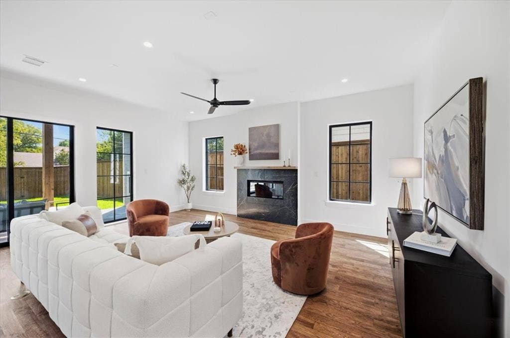 4320 Concho Street, Dallas, TX 75206 Wood-finish flooring throughout, complemented by a modern ceiling fan and recessed lighting