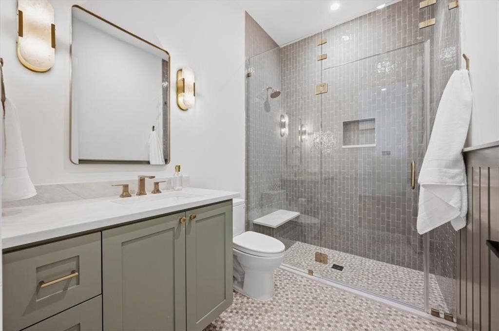 4320 Concho Street, Dallas, TX 75206 Glass-enclosed shower with subway tile surround, built-in shower niche, and integrated bench