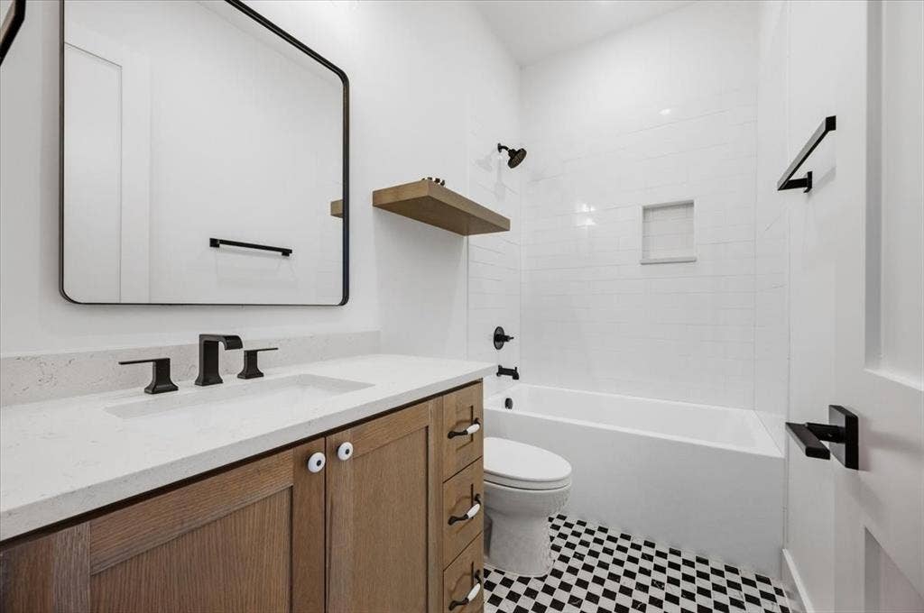 4320 Concho Street, Dallas, TX 75206 Bathroom with wood-finish vanity, white countertop, and matte black fixtures