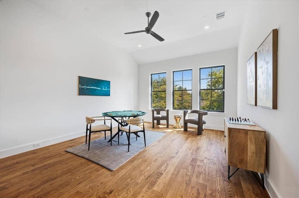 4320 Concho Street, Dallas, TX 75206 Hardwood flooring, three casement windows, a ceiling fan, recessed lighting, and high ceilings