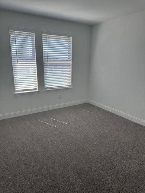 109 North Sky Drive, Celina, TX 75009 Plush gray carpeting, white painted walls, and two windows with horizontal blinds