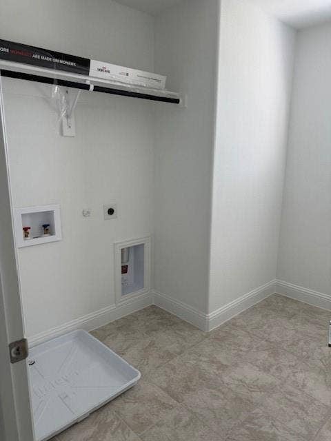 109 North Sky Drive, Celina, TX 75009 Utility room with a built-in shelf, hanging rod, and tile flooring