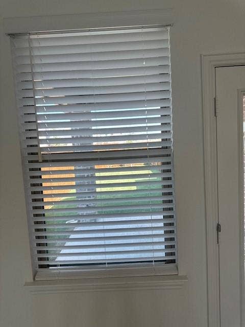 109 North Sky Drive, Celina, TX 75009 Window featuring white horizontal blinds, a white window frame, and a decorative window sill