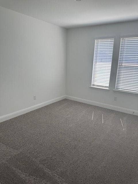 109 North Sky Drive, Celina, TX 75009 Neutral wall paint, two windows with blinds, and plush carpeting