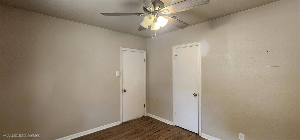 2016 Gavin Road, Tool, TX 75143 Bedroom2 neutral wall tones, two paneled doors, and ceiling fan with integrated lighting