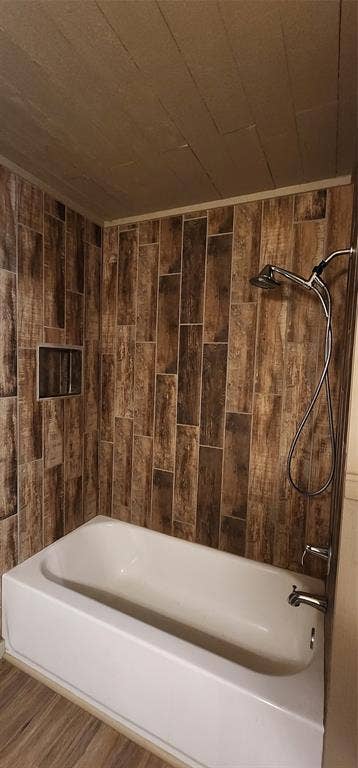 2016 Gavin Road, Tool, TX 75143 Tub/shower combination featuring wood-look tile surround and integrated shower niche
