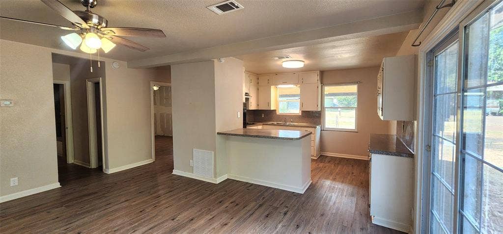 2016 Gavin Road, Tool, TX 75143 Vinyl flooring throughout, with a ceiling fan in the living area