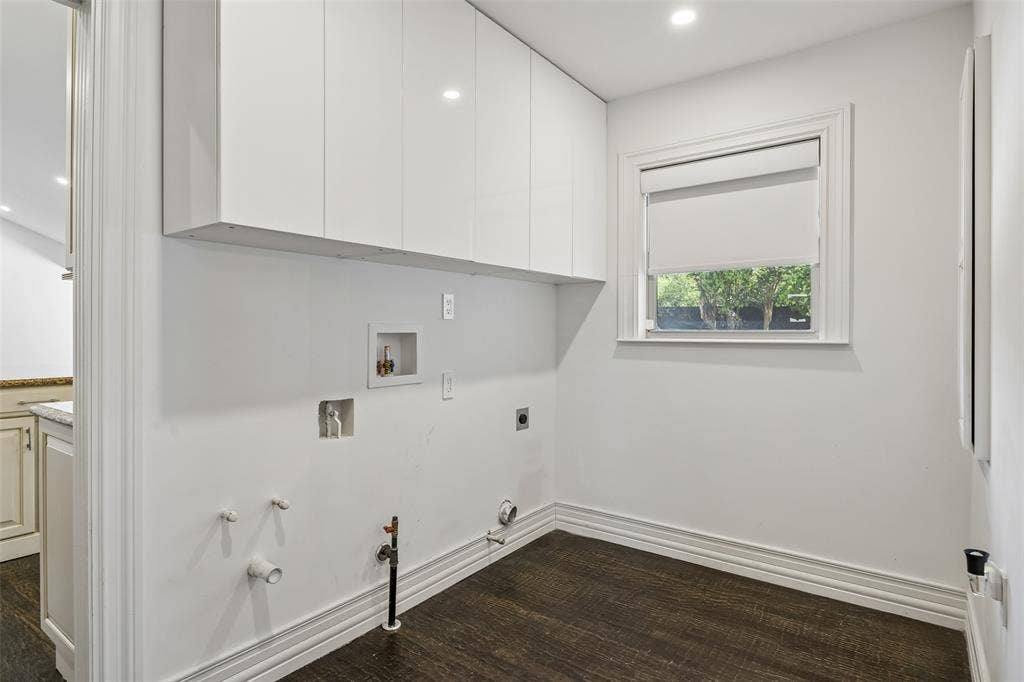 5610 Forest Lane, Dallas, TX 75230 Utility room with overhead white cabinetry, dark wood-finish flooring, recessed lighting, and a window with a roller shade