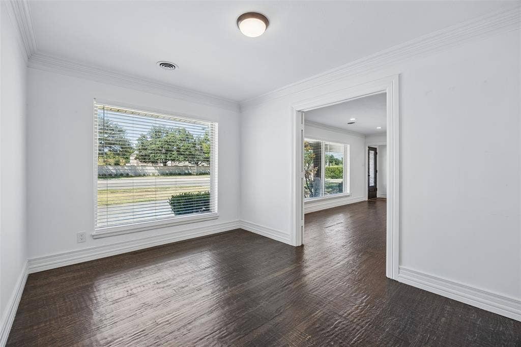 5610 Forest Lane, Dallas, TX 75230 Wood-finish flooring, crisp white walls, and a recessed ceiling light fixture
