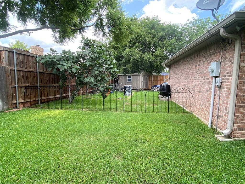 1631 Greenway Court, Midlothian, TX 76065 View of yard with a shed
