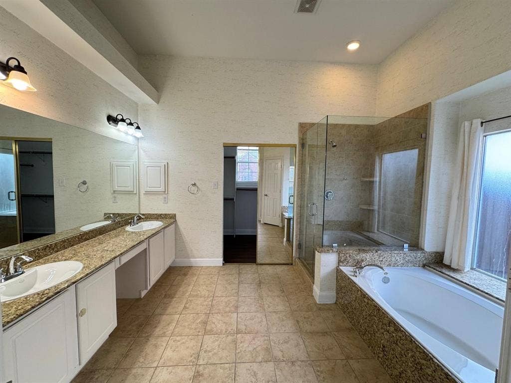 4531 Oak Shores Drive, Plano, TX 75024 Dual vanity with integrated sinks, granite-look countertops, and white cabinetry