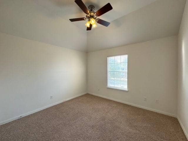 4531 Oak Shores Drive, Plano, TX 75024 Vaulted ceiling with a ceiling fan, neutral wall paint, and carpet flooring