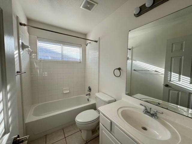 4531 Oak Shores Drive, Plano, TX 75024 White tile flooring, white bathtub, white tiled shower surround, integrated sink with white countertop, and vanity mirror