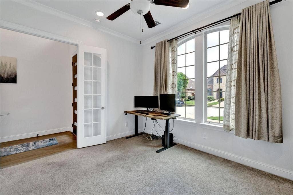 625 Quarter Horse Lane, Frisco, TX 75036 Carpeted room with crown molding, a ceiling fan, and French doors