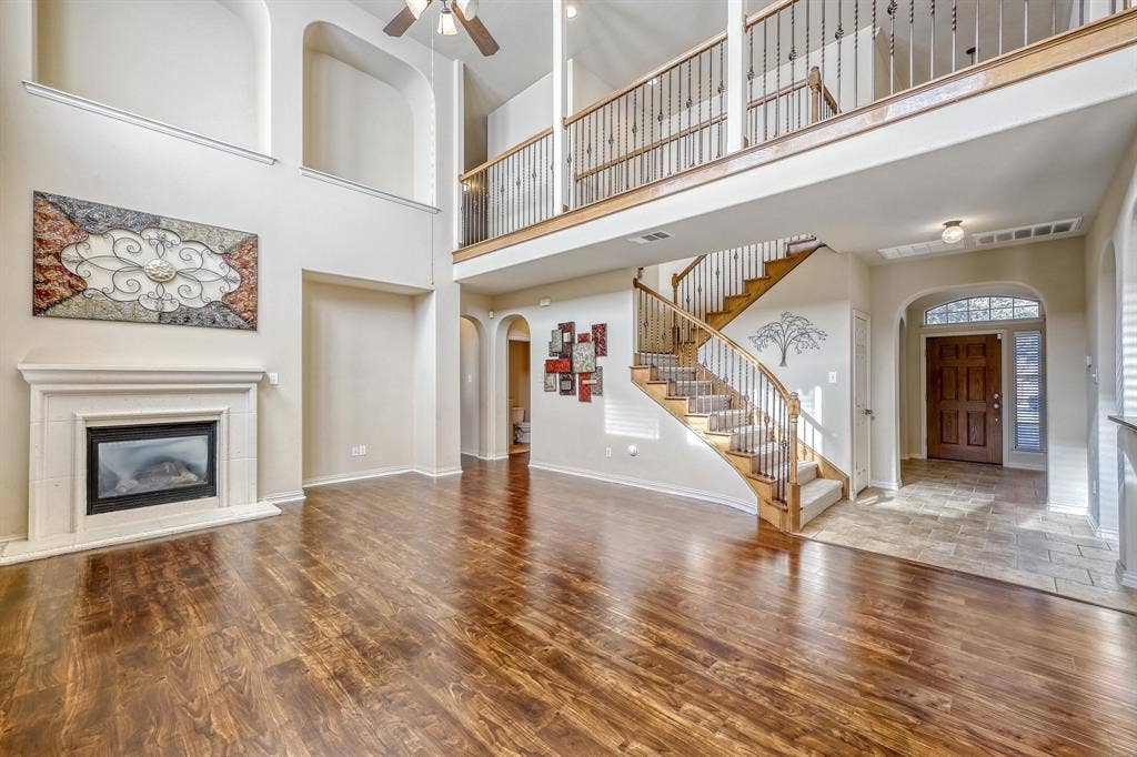 1012 Surrey Drive, DeSoto, TX 75115 Wood-finish flooring throughout, with a tiled entry