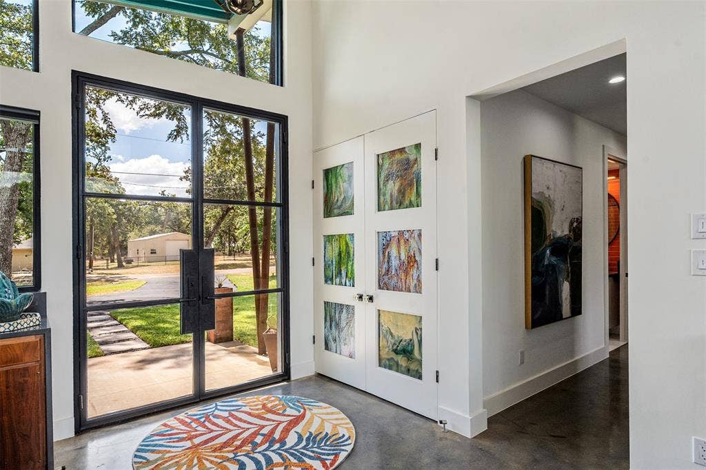 105 Azalea Court, Trinidad, TX 75163 Double steel-framed glass doors, featuring dallas crafted "bullseye" stained glass