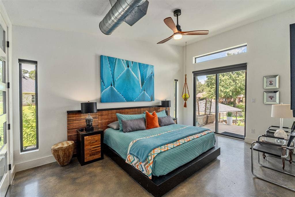 105 Azalea Court, Trinidad, TX 75163 Primary en-suite bedroom with lake and pool views, custom closet, and sliding glass doors for ease-ability to backyard oasis.
