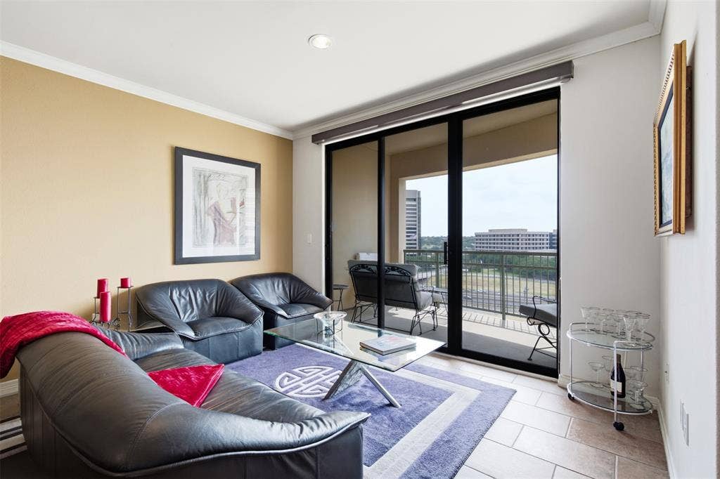 330 Las Colinas Boulevard E, #1216, Irving, TX 75039 Sliding glass doors opening to a private balcony, recessed ceiling lighting, crown molding, and tiled flooring