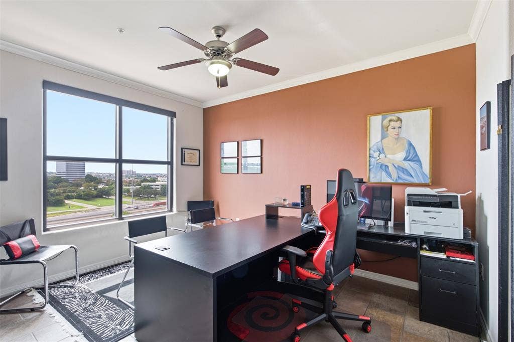 330 Las Colinas Boulevard E, #1216, Irving, TX 75039 Large windows offering urban scenery, crown molding, a ceiling fan with integrated lighting, wood-finish flooring, and a spacious desk area