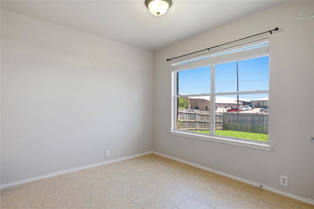217 Ame Lane, Royse City, TX 75189 Neutral wall finishes, recessed window, tile flooring, and flush-mount ceiling light fixture