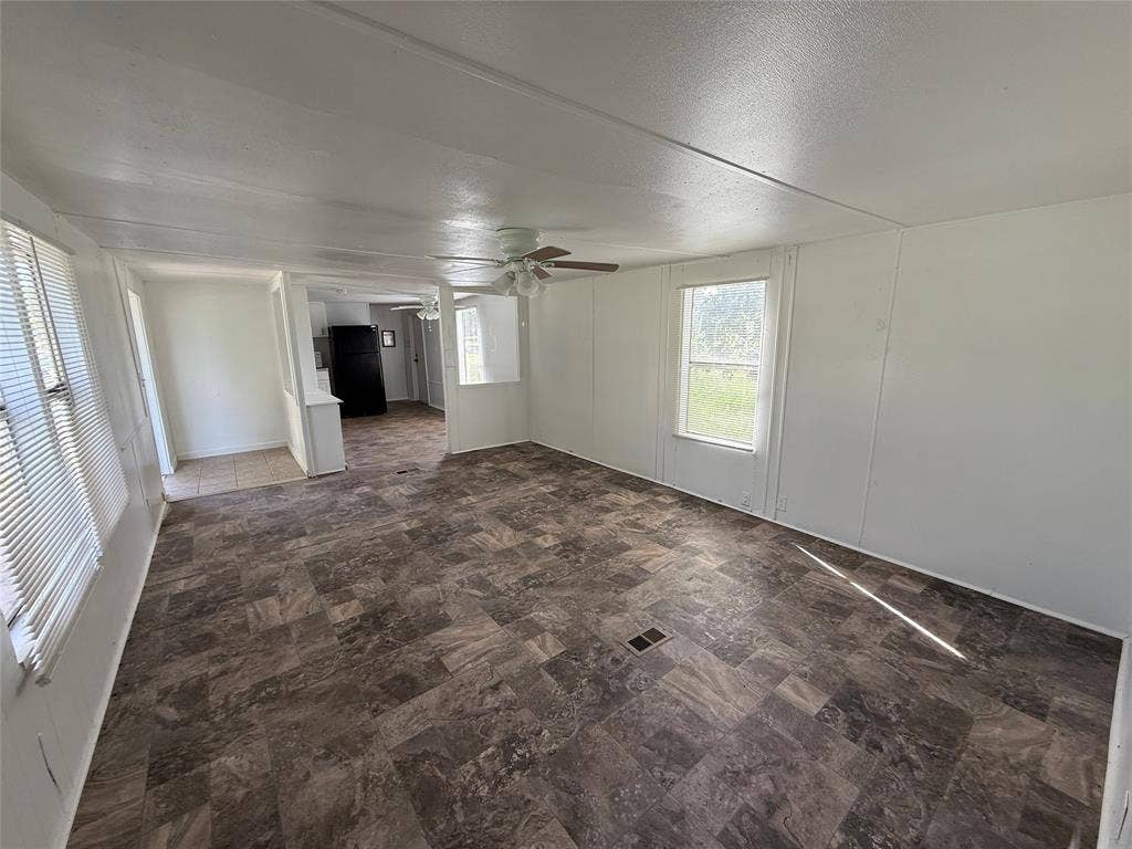 Large living room with view towards kitchen