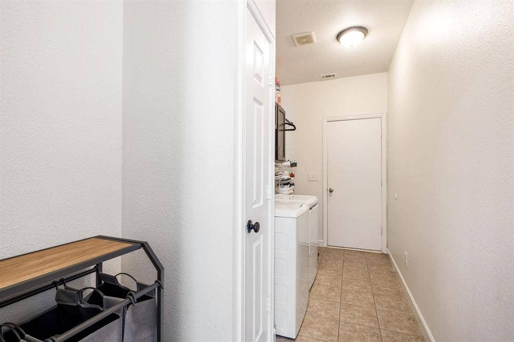 11414 Promenade Road, Frisco, TX 75035 Laundry area featuring tile flooring, a ceiling-mounted light fixture, and white walls