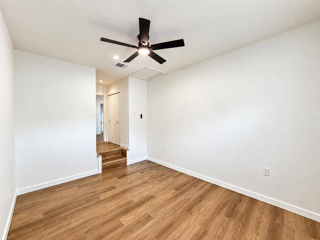 1737 Alta Vista Street, Mesquite, TX 75149 Room featuring wood-finish flooring, recessed lighting, and a multi-blade matte black ceiling fan
