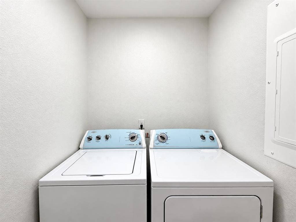1737 Alta Vista Street, Mesquite, TX 75149 Dedicated laundry alcove featuring side-by-side appliances and a wall-mounted electrical panel
