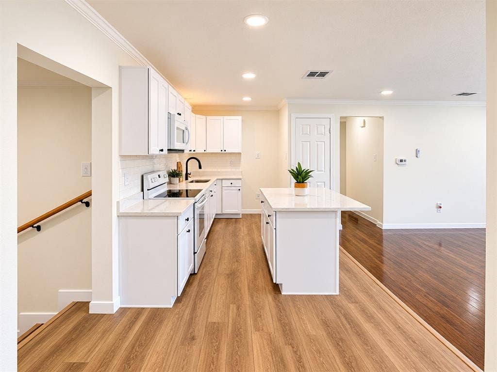 1737 Alta Vista Street, Mesquite, TX 75149 Kitchen featuring white shaker-style cabinetry, quartz countertops, a central island with counter seating, wood-finish flooring, and recessed lighting