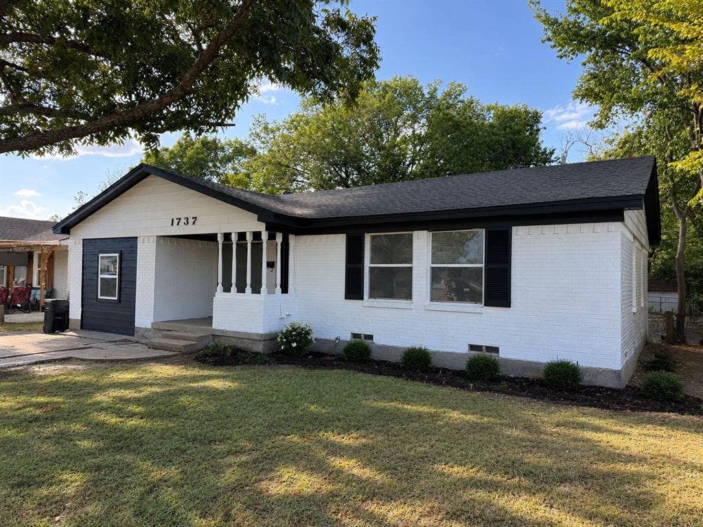 1737 Alta Vista Street, Mesquite, TX 75149 Exterior featuring white painted brick, black shutters, dark shingle roof, and a covered entry