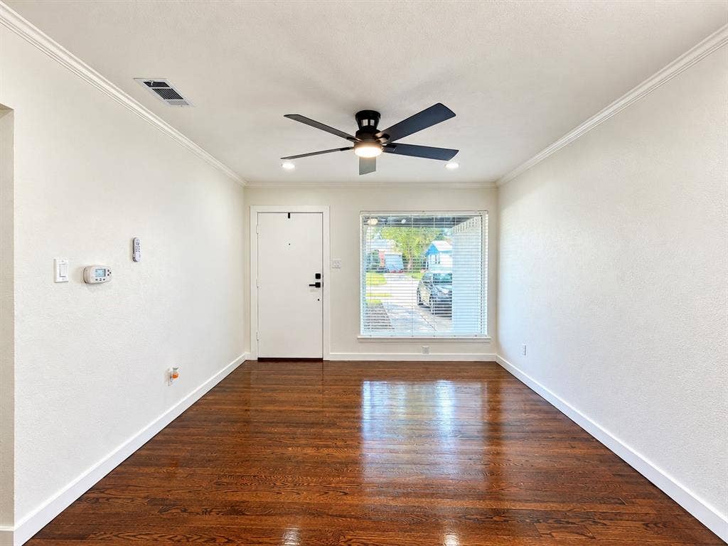 1737 Alta Vista Street, Mesquite, TX 75149 Interior space featuring wood-finish flooring, crown molding, and a central ceiling fan with integrated lighting