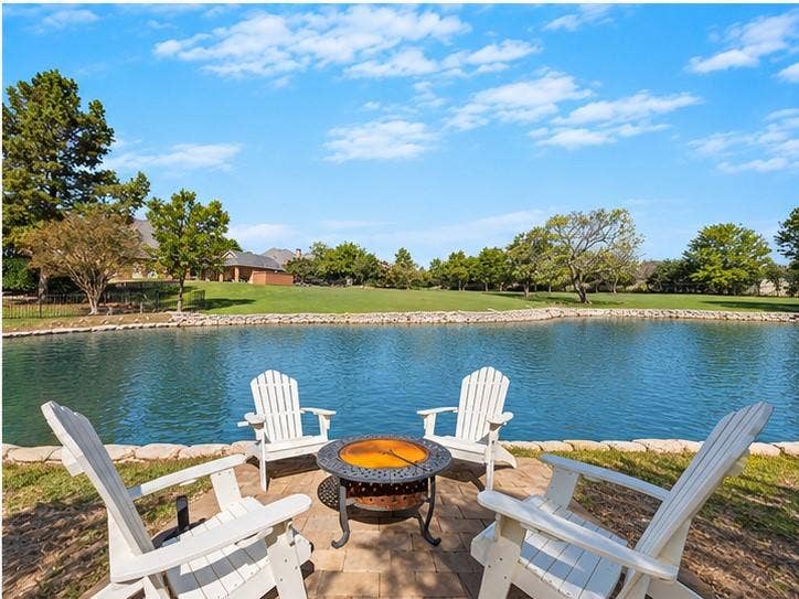508 Moraine Way, Heath, TX 75032 Beautifully designed outdoor living spaces overlooking the pool and pond.