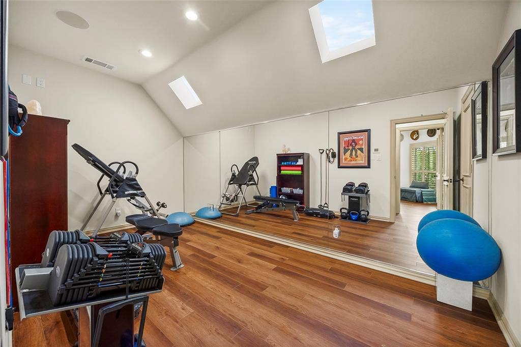 508 Moraine Way, Heath, TX 75032 Dedicated exercise room with skylights and ample space for fitness equipment