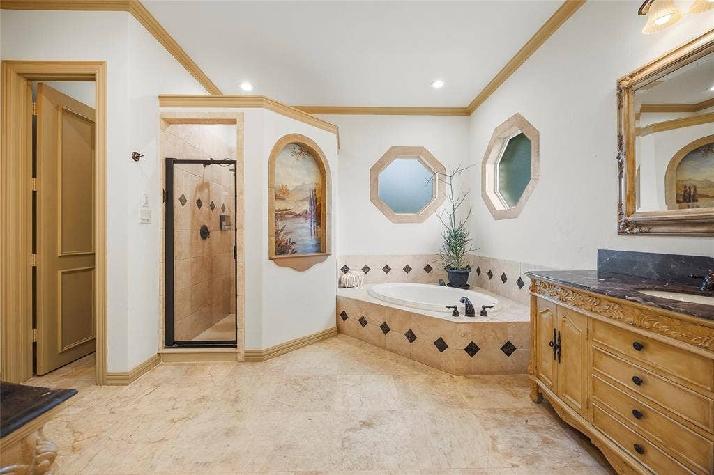 508 Moraine Way, Heath, TX 75032 Elegant bathroom featuring a spacious walk-in shower and refined finishes.