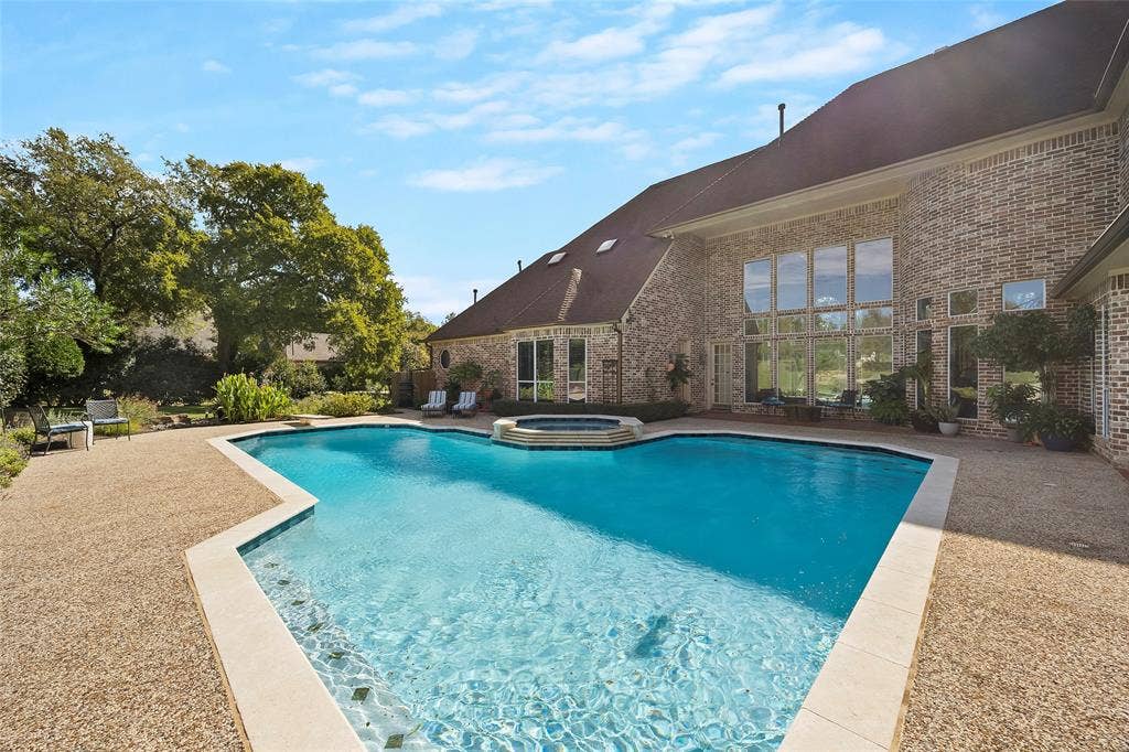 508 Moraine Way, Heath, TX 75032 Sparkling pool and spa surrounded by expansive patio space for entertaining.