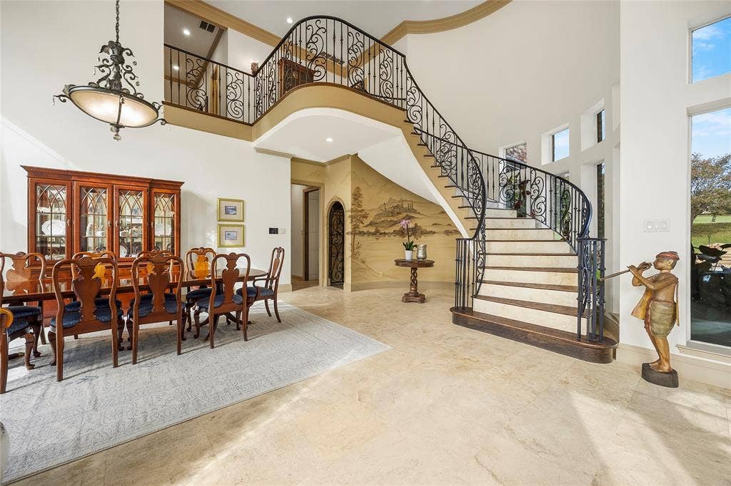 508 Moraine Way, Heath, TX 75032 Elegant formal dining room with soaring ceilings and architectural detailing.
