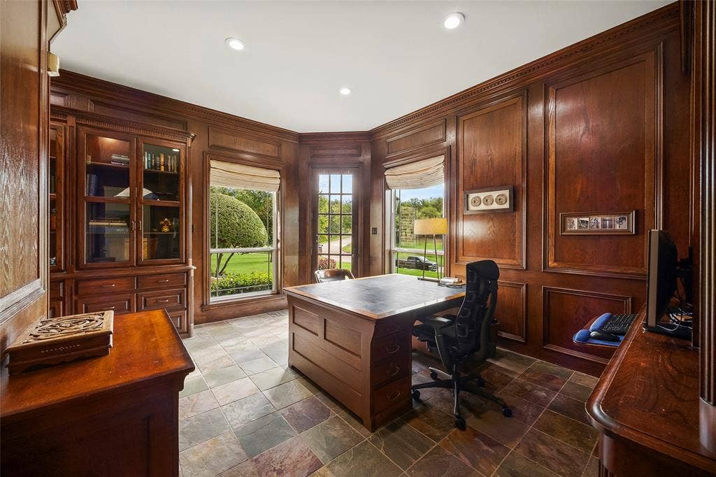 508 Moraine Way, Heath, TX 75032 Distinguished wood-paneled study with custom built-ins and beautiful views.