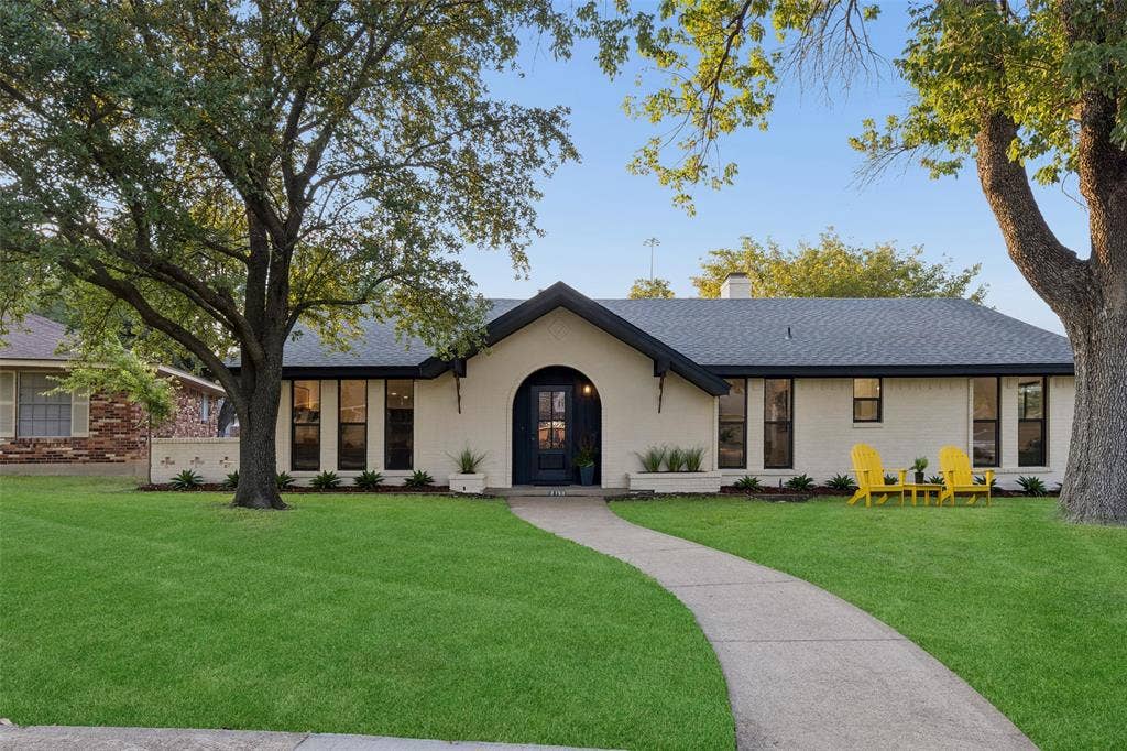 2133 Oak Valley Lane, Dallas, TX 75232 Single-story residence featuring a gray asphalt shingle roof and a light-colored brick exterior