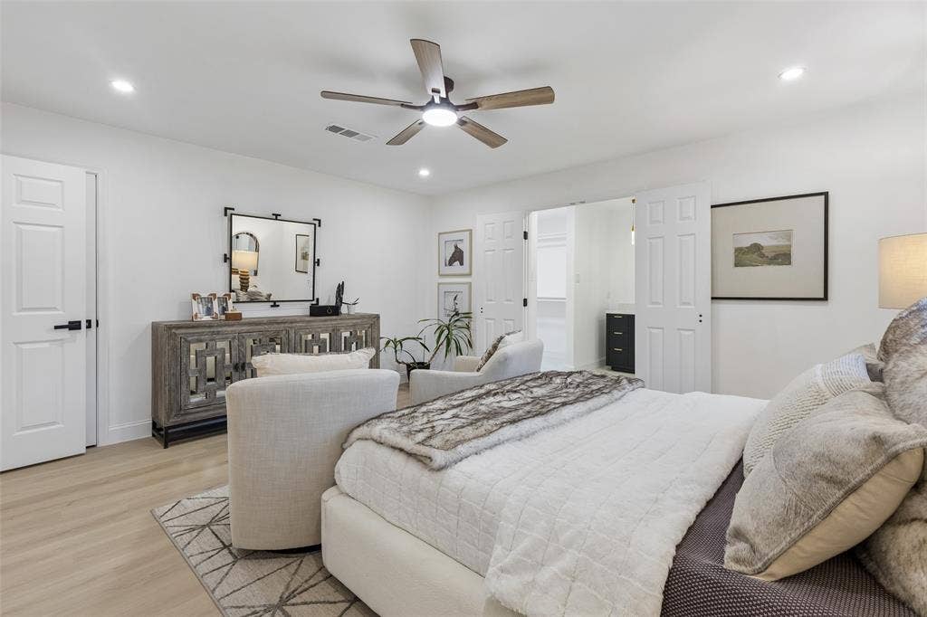 2133 Oak Valley Lane, Dallas, TX 75232 Recessed lighting, wood-finish flooring, ceiling fan, white paneled doors, and matte black door hardware