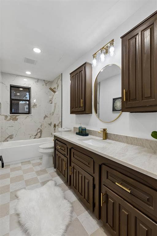 2133 Oak Valley Lane, Dallas, TX 75232 Dual wood-finish vanity with a light-toned countertop, integrated sink, and a gold-finish faucet