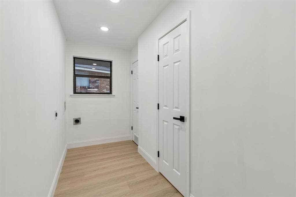 2133 Oak Valley Lane, Dallas, TX 75232 Utility space featuring light wood-finish flooring, recessed lighting, and a window with dark trim