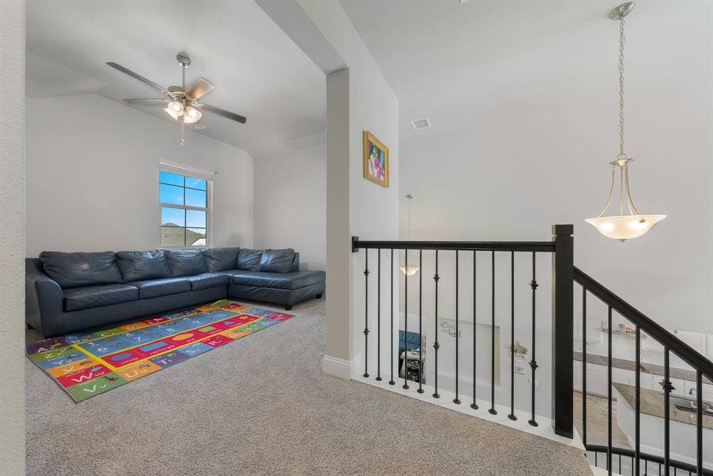 Climb up the stairs to the game room with ceiling fan
