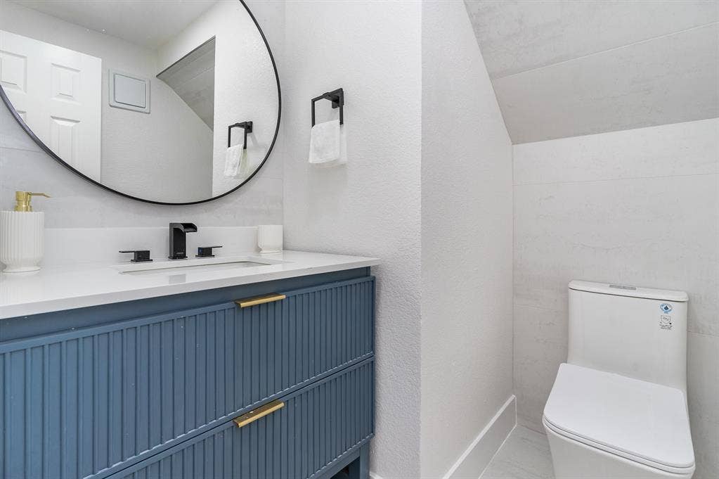 17732 Windflower Way, Dallas, TX 75252 Bathroom featuring toilet and vanity
