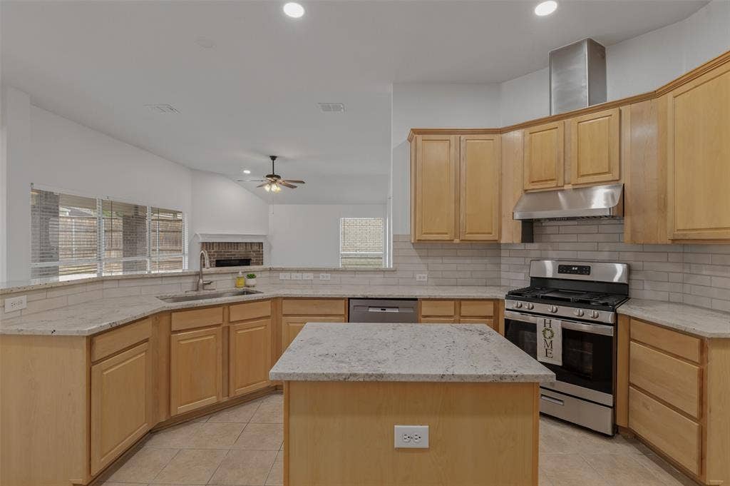 2809 Hollow Ridge Drive, Denton, TX 76210 Kitchen updates include new granite countertops, backsplash, SS appliances and fixtures