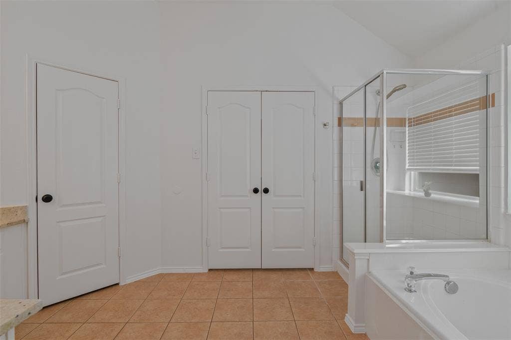 2809 Hollow Ridge Drive, Denton, TX 76210 Primary bath with walk in closet, garden tub and walk & separate shower