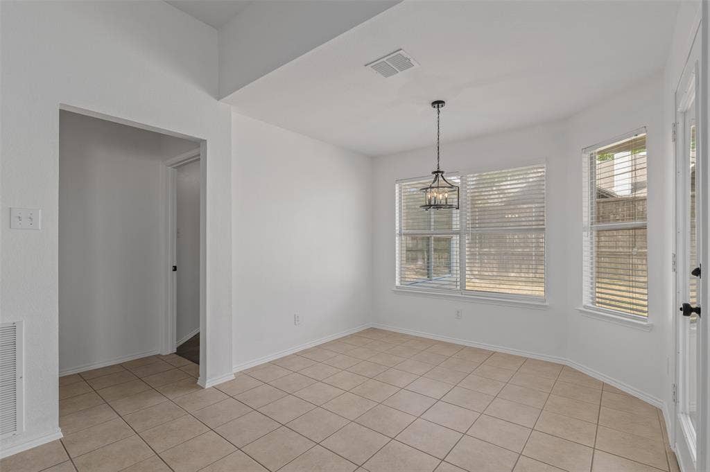 2809 Hollow Ridge Drive, Denton, TX 76210 Breakfast area with access out to the back porch or to the tucked away Primary bedroom.