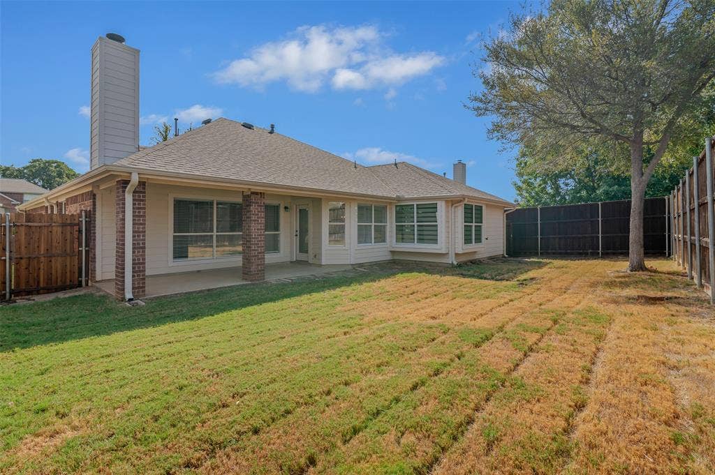 2809 Hollow Ridge Drive, Denton, TX 76210 Enjoy time outside under the large covered porch while enjoying the privacy the 8ft board on board fence creates. The large grassy area provides plenty of space for a playset, pool or other outdoor needs.