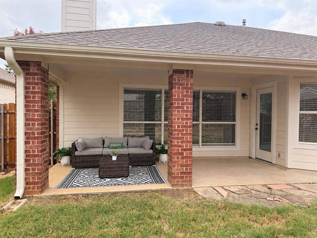 2809 Hollow Ridge Drive, Denton, TX 76210 This oversized covered back patio has room for outdoor seating and a dining area or envision evenings grilling out at your built in kitchen! Virtually staged.