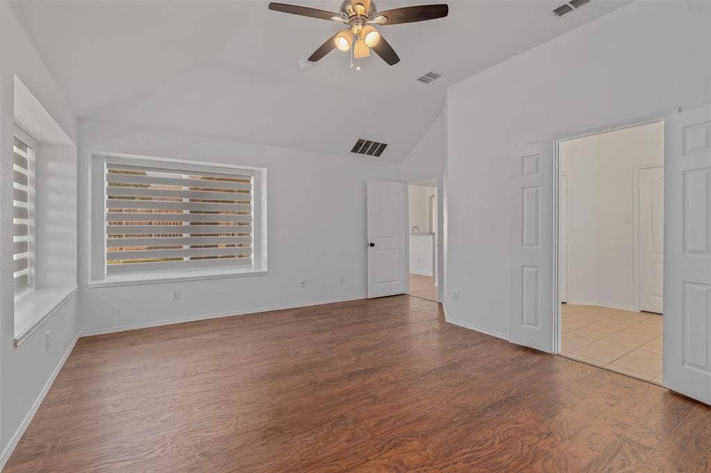 2809 Hollow Ridge Drive, Denton, TX 76210 Primary bedroom with ensuite bath.