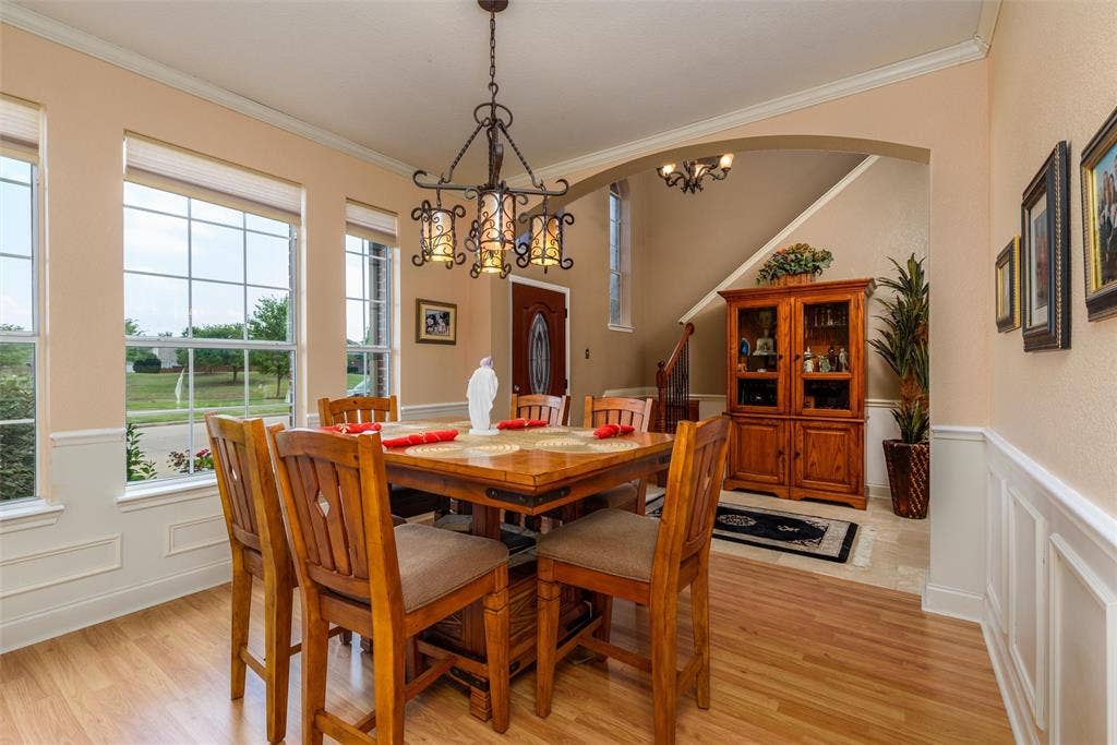 5800 Pine Ridge Boulevard, McKinney, TX 75070 Dining area with ornamental molding sits off the front entry.